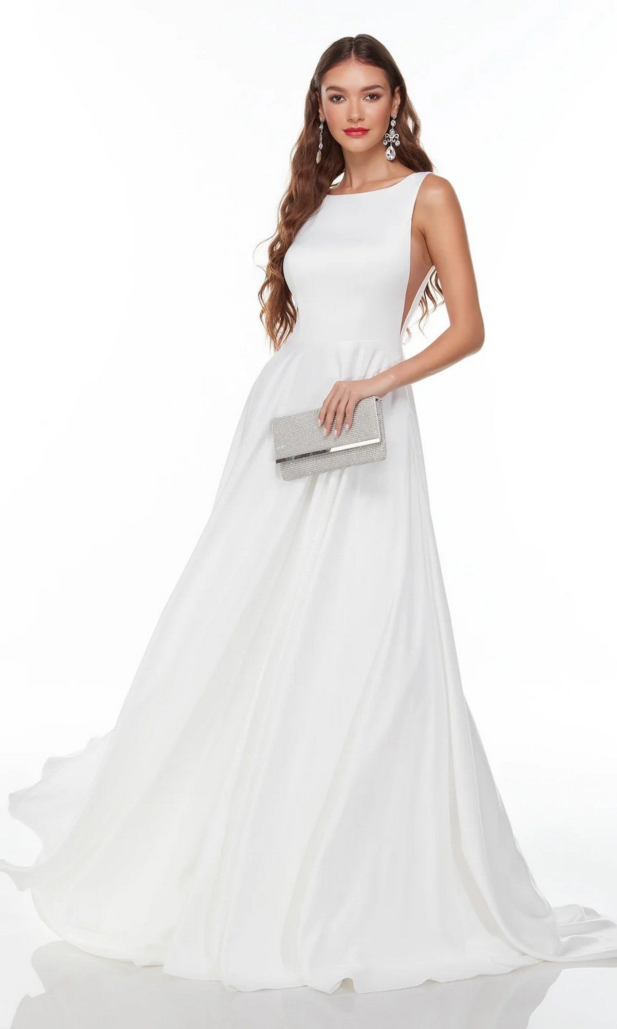 A woman wears the Alyce 7053 long white dress featuring a sleeveless satin bodice and elegant A-line skirt, styled with a silver clutch and statement earrings, standing against a plain white background.